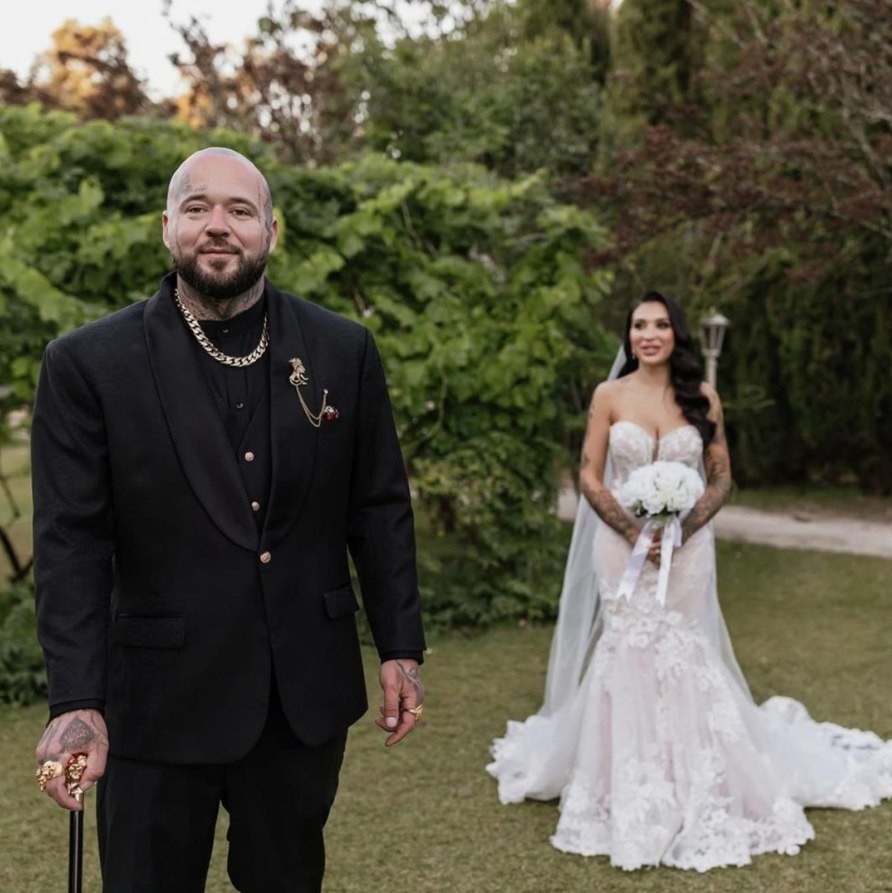 Perfect Attire | Wedding Suits & Tuxedos Singapore Groom in a tonal black three-piece suit with his bride
