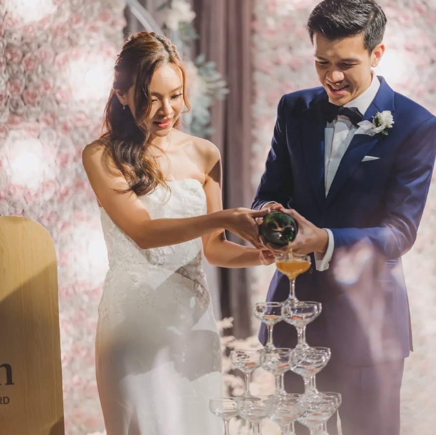 Perfect Attire | Wedding Suits & Tuxedos Singapore Groom in a classic navy suit with his bride